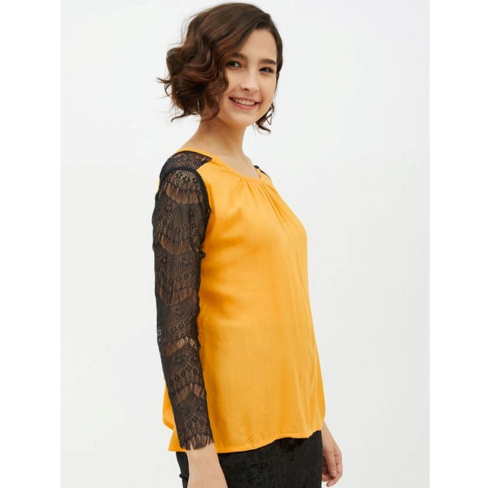 Yellow rayon top for women — styled view